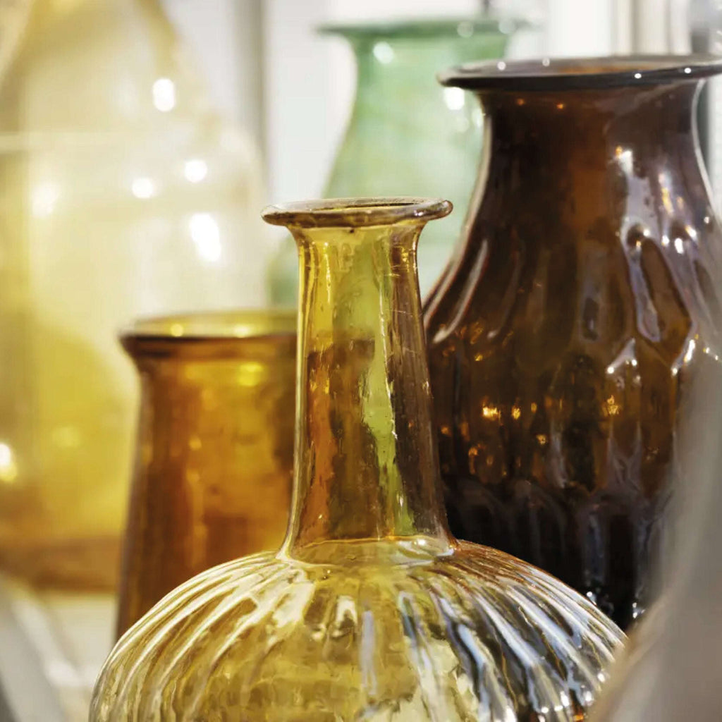 Amber glass vase with speckled bubble texture.
Amber Glass Vase - Jo And Co Amber Glass Vase