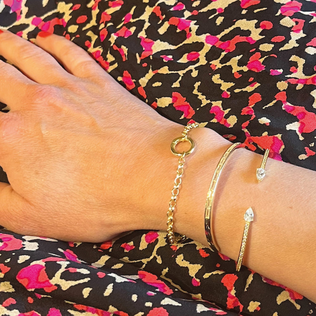 Gold bracelet with two clear gemstones.
Astra Bracelet - Jo And Co Astra Bracelet