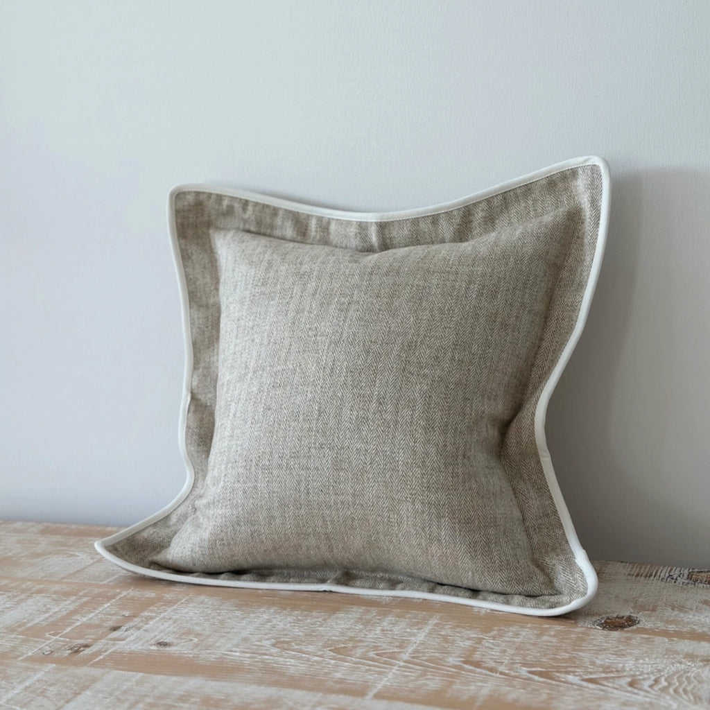 Beige herringbone cushion with white trim.
Beige Herringbone Tia Cushion - Jo And Co Beige Herringbone Tia Cushion