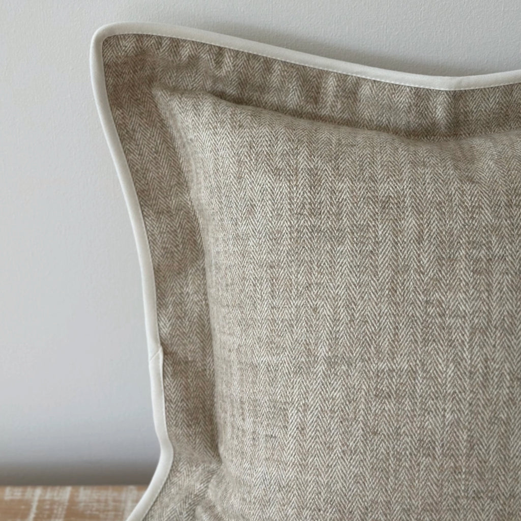 Beige herringbone cushion with white trim.
Beige Herringbone Tia Cushion - Jo And Co Beige Herringbone Tia Cushion