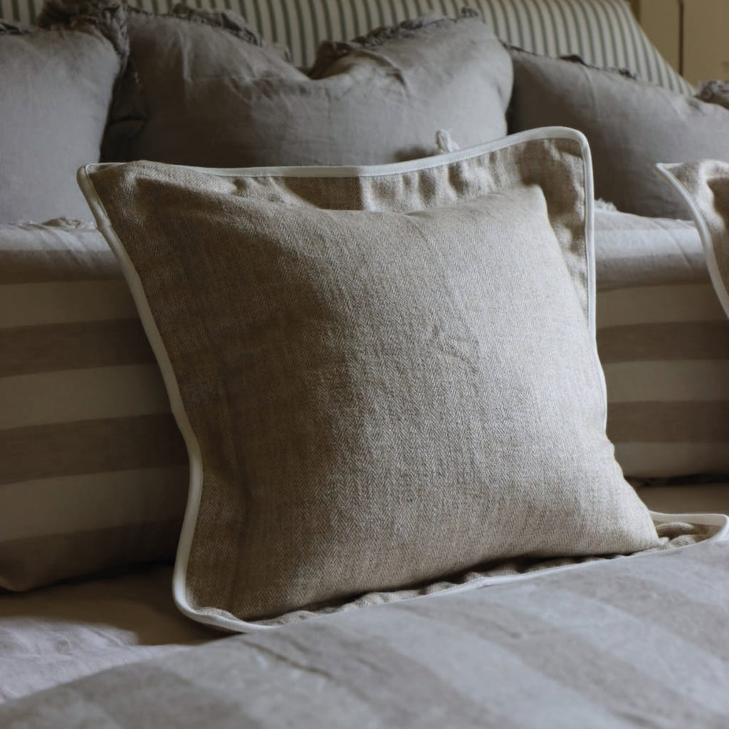 Beige herringbone cushion with white trim.
Beige Herringbone Tia Cushion - Jo And Co Beige Herringbone Tia Cushion