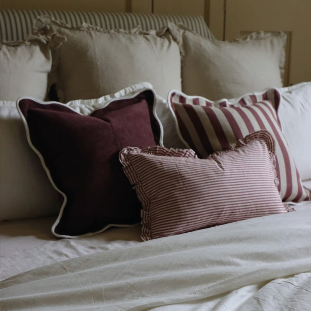 Striped cotton cushion with ruffled edges.
Burgundy Stripe Ruffle Darcy Cushion - Jo And Co Burgundy Stripe Ruffle Darcy Cushion