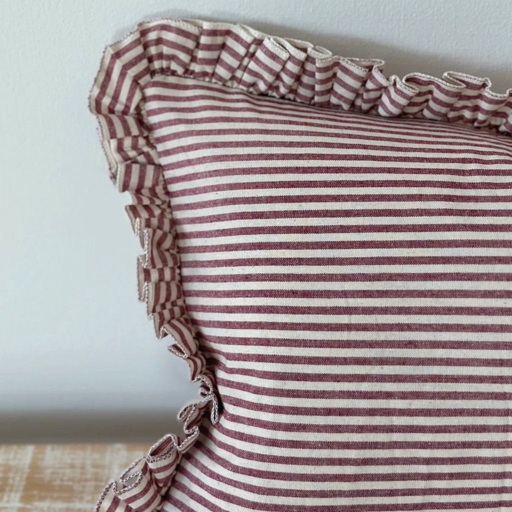 Striped cotton cushion with ruffled edges.
Burgundy Stripe Ruffle Darcy Cushion - Jo And Co Burgundy Stripe Ruffle Darcy Cushion