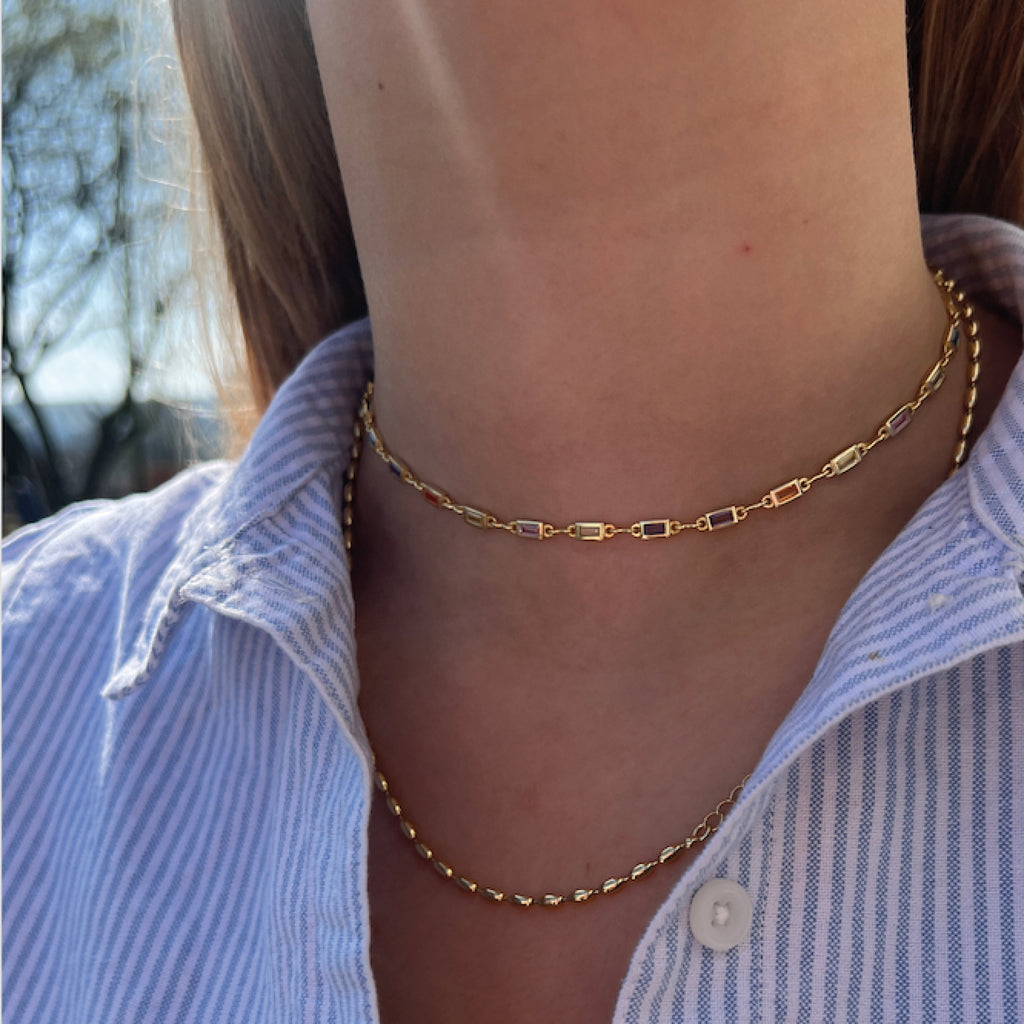 Gold necklace with colourful gemstones.
Carnival Choker - Jo And Co Carnival Choker