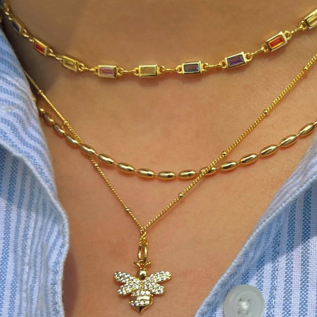 Gold necklace with colourful gemstones.
Carnival Choker - Jo And Co Carnival Choker