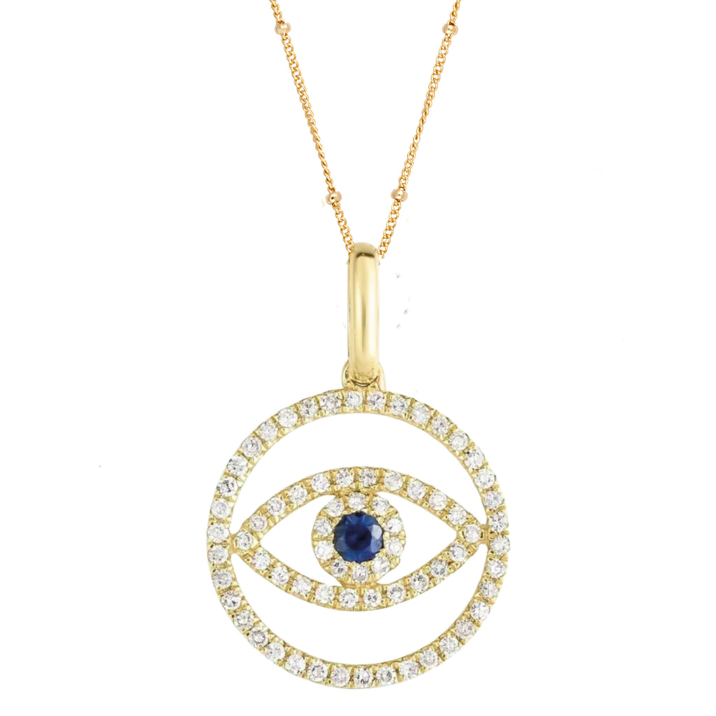 Gold necklace with an evil eye-shaped pendant featuring a blue gemstone.
Evil Eye Pendant - Jo And Co Evil Eye Pendant