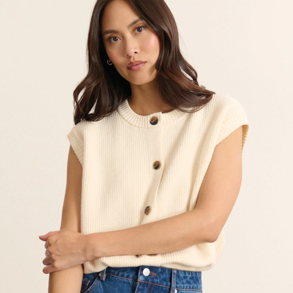 Sleeveless ecru vest with button up front.
Garance Paris Ecru Bisou Knit Vest - Jo And Co Garance Paris Ecru Bisou Knit Vest - Garance Paris