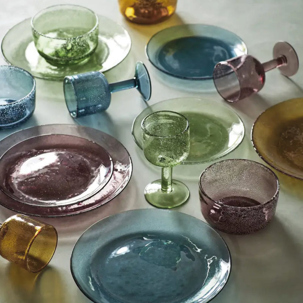 Purple glass bowl with a textured surface and bubbles.
Purple Coloured Glass Bowl - Jo And Co Purple Coloured Glass Bowl