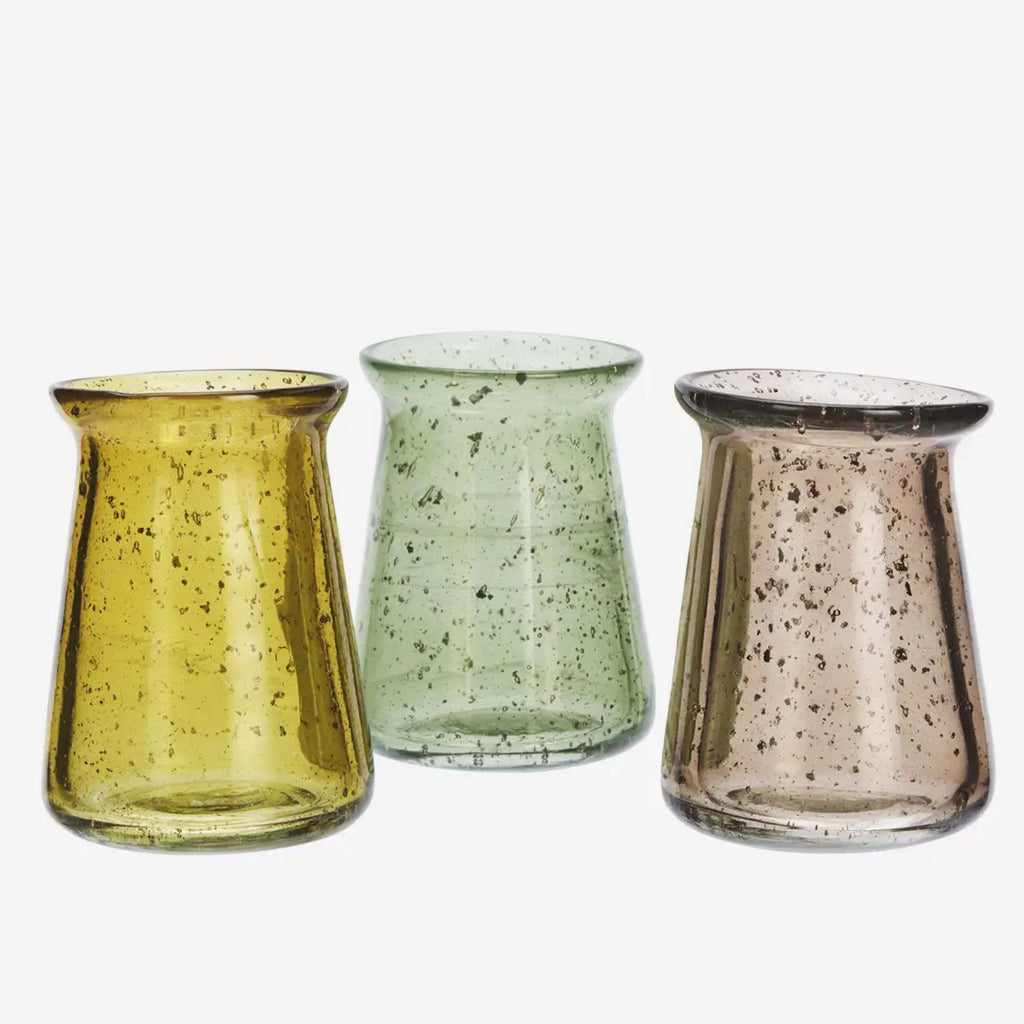 Green glass vase with speckled bubble pattern.
Green Glass Vase - Jo And Co Green Glass Vase