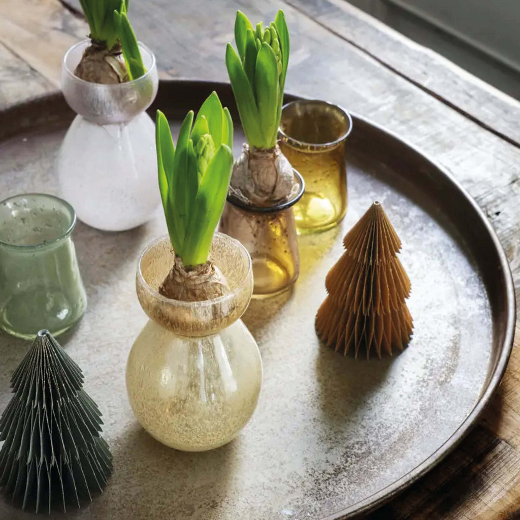 Green glass vase with speckled bubble pattern.
Green Glass Vase - Jo And Co Green Glass Vase