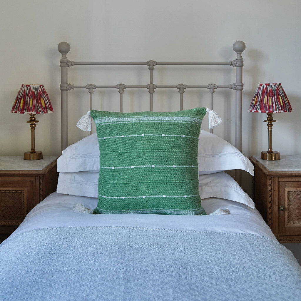 Green cushion with tassels and a slub yarn weave.
Green Tassel Cushion - Jo And Co Green Tassel Cushion