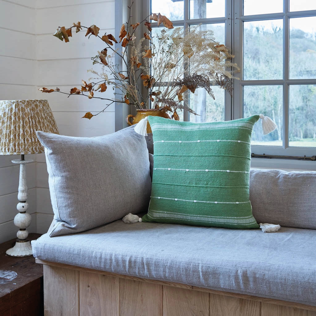 Green cushion with tassels and a slub yarn weave.
Green Tassel Cushion - Jo And Co Green Tassel Cushion