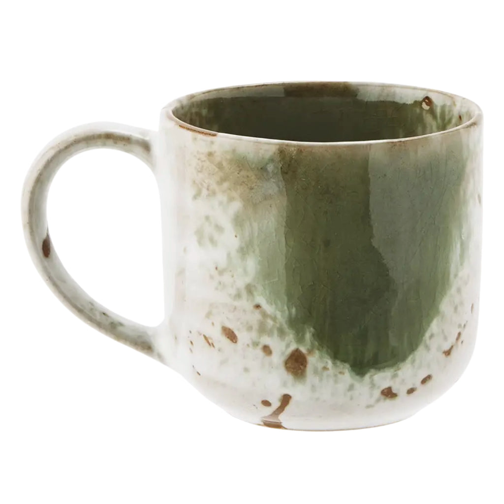 Green ceramic mug with speckled white and green glaze.
Green & White Stoneware Mug - Jo And Co Green & White Stoneware Mug