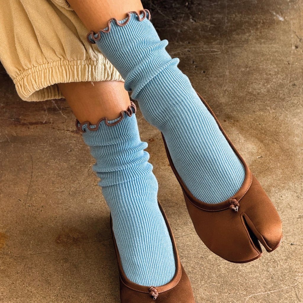 Blue socks with ruffled brown top.
Le Bon Shoppe Ruffled Modal Powder Blue Socks - Jo And Co Le Bon Shoppe Ruffled Modal Powder Blue Socks - Le Bon Shoppe