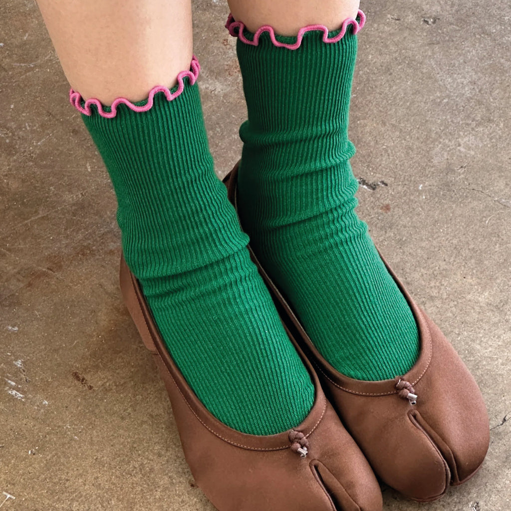 Green sock with pink ruffled trim.
Le Bon Shoppe Ruffled Modal Spinach Socks - Jo And Co Le Bon Shoppe Ruffled Modal Spinach Socks - Le Bon Shoppe