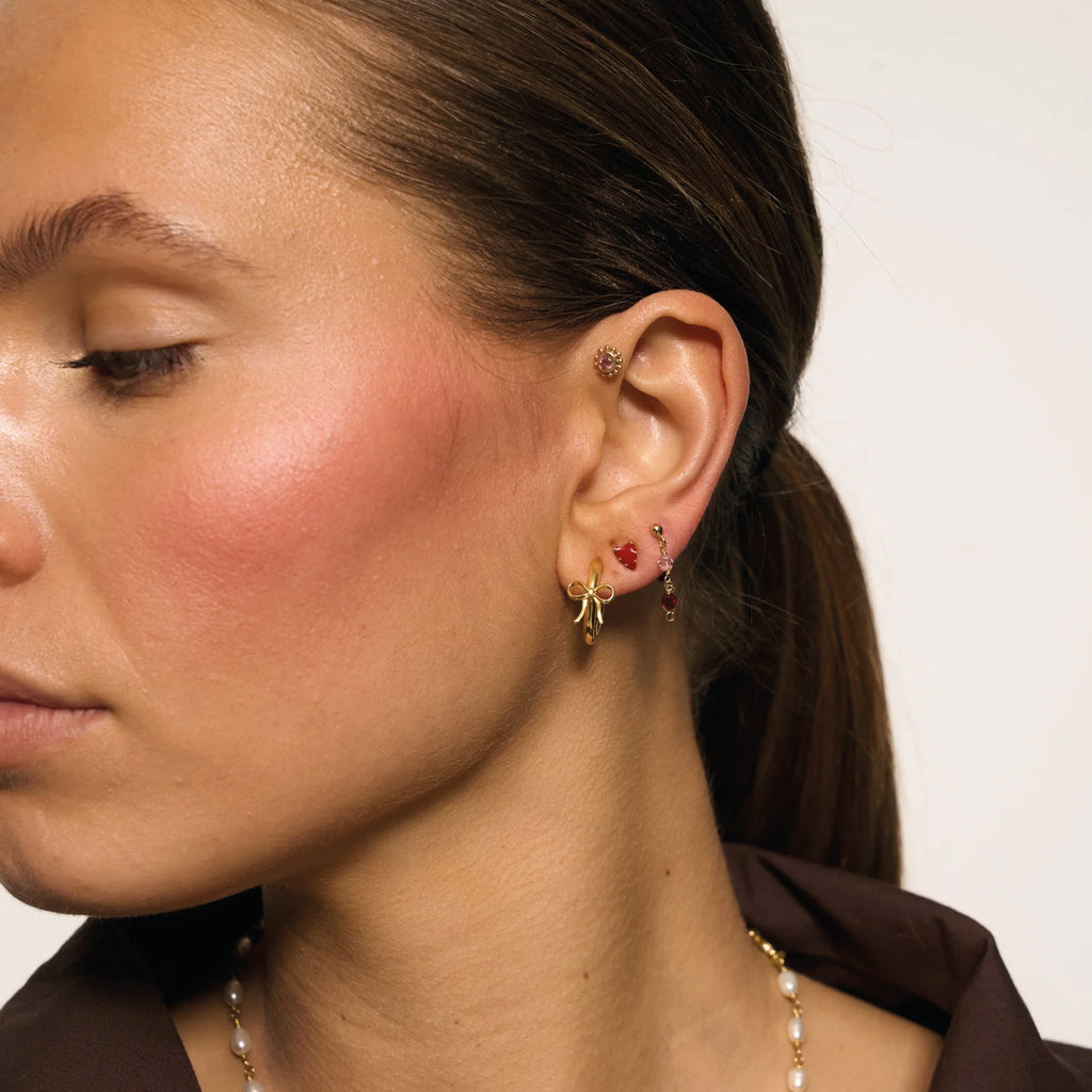 Red heart-shaped earrings with gold accents.
Lolita Heart Stud Gold Plated Earrings - Jo And Co Lolita Heart Stud Gold Plated Earrings - Anna + Nina