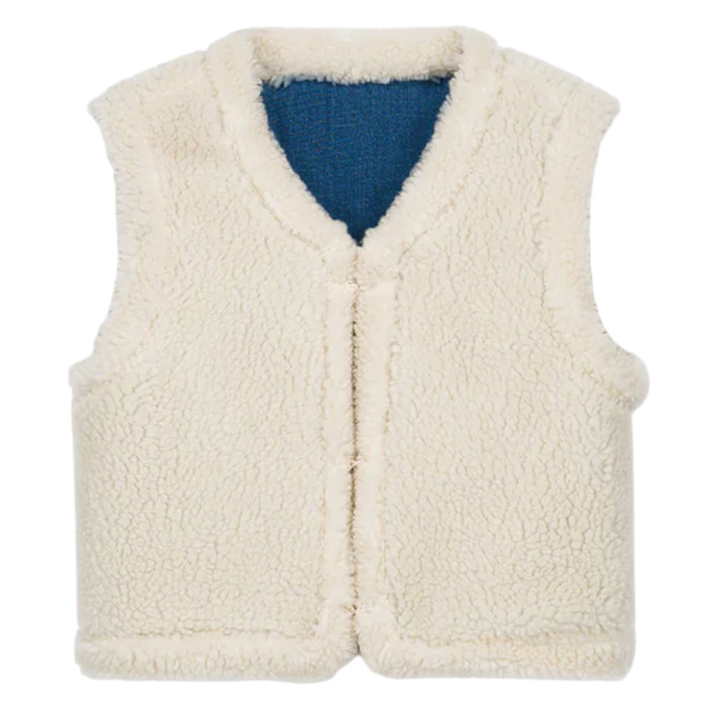Blue denim reversible vest with white sherpa lining and embroideries.
Louise Misha Stone Blue Figara Reversible Vest - Jo And Co Louise Misha Stone Blue Figara Reversible Vest - Louise Misha