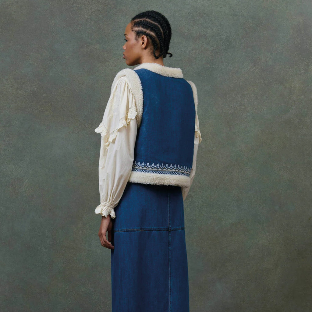 Blue denim reversible vest with white sherpa lining and embroideries.
Louise Misha Stone Blue Figara Reversible Vest - Jo And Co Louise Misha Stone Blue Figara Reversible Vest - Louise Misha