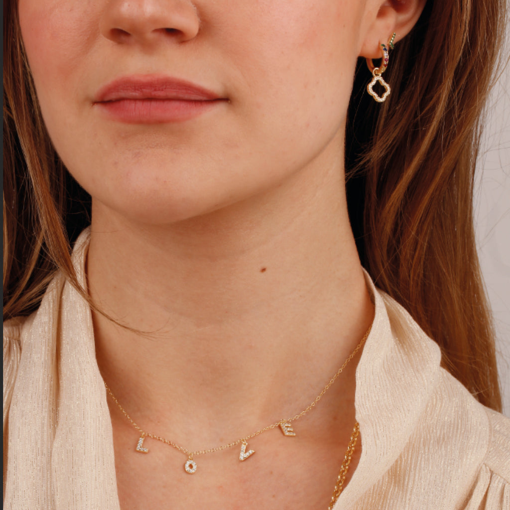 Gold chain necklace with L O V E pendants with white stones.
Love Letter Pendant - Jo And Co Love Letter Pendant