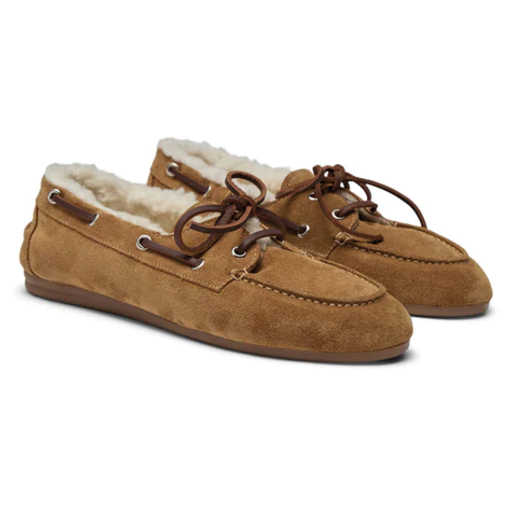 Pair of brown suede shoes with white fur lining on a white background.
Pavement Tan Suede Vilde Loafers - Jo And Co Pavement Tan Suede Vilde Loafers - Pavement