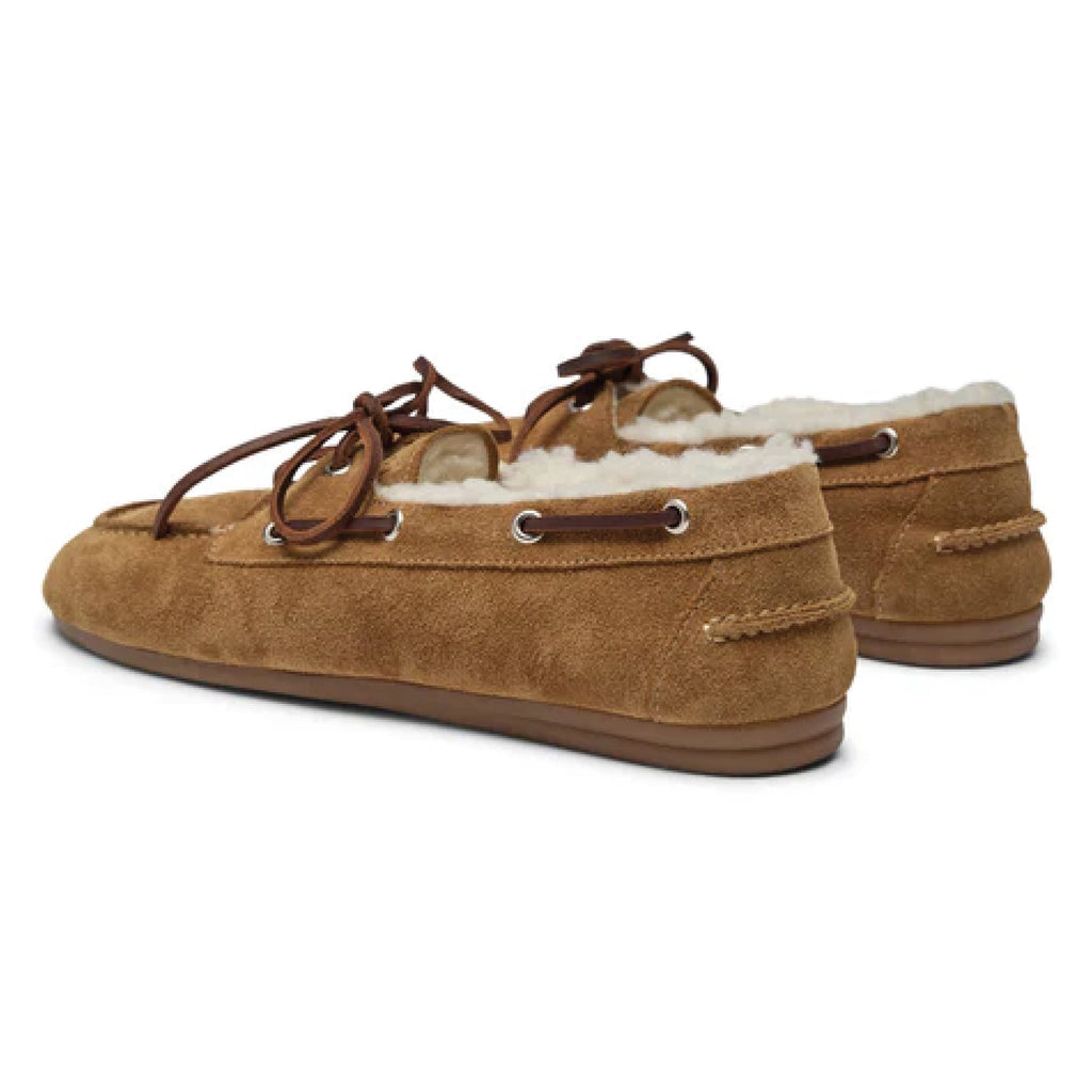 Pair of brown suede shoes with white fur lining on a white background.
Pavement Tan Suede Vilde Loafers - Jo And Co Pavement Tan Suede Vilde Loafers - Pavement