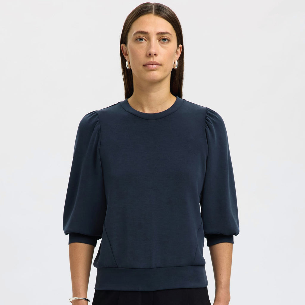 Navy blue sweater with puff sleeves.
Selected Femme Tenny Dark Sapphire Puff Sleeve Sweatshirt - Jo And Co Selected Femme Tenny Dark Sapphire Puff Sleeve Sweatshirt - Selected Femme