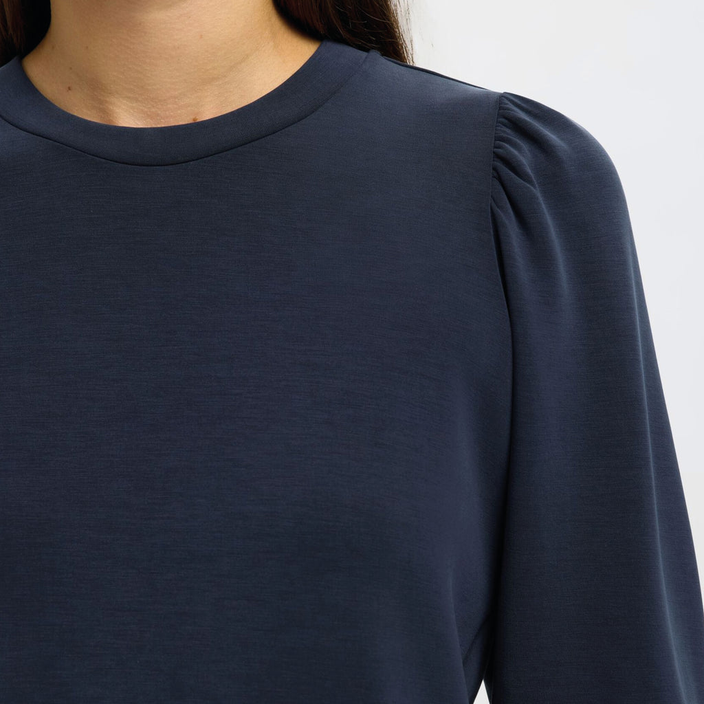 Navy blue sweater with puff sleeves.
Selected Femme Tenny Dark Sapphire Puff Sleeve Sweatshirt - Jo And Co Selected Femme Tenny Dark Sapphire Puff Sleeve Sweatshirt - Selected Femme