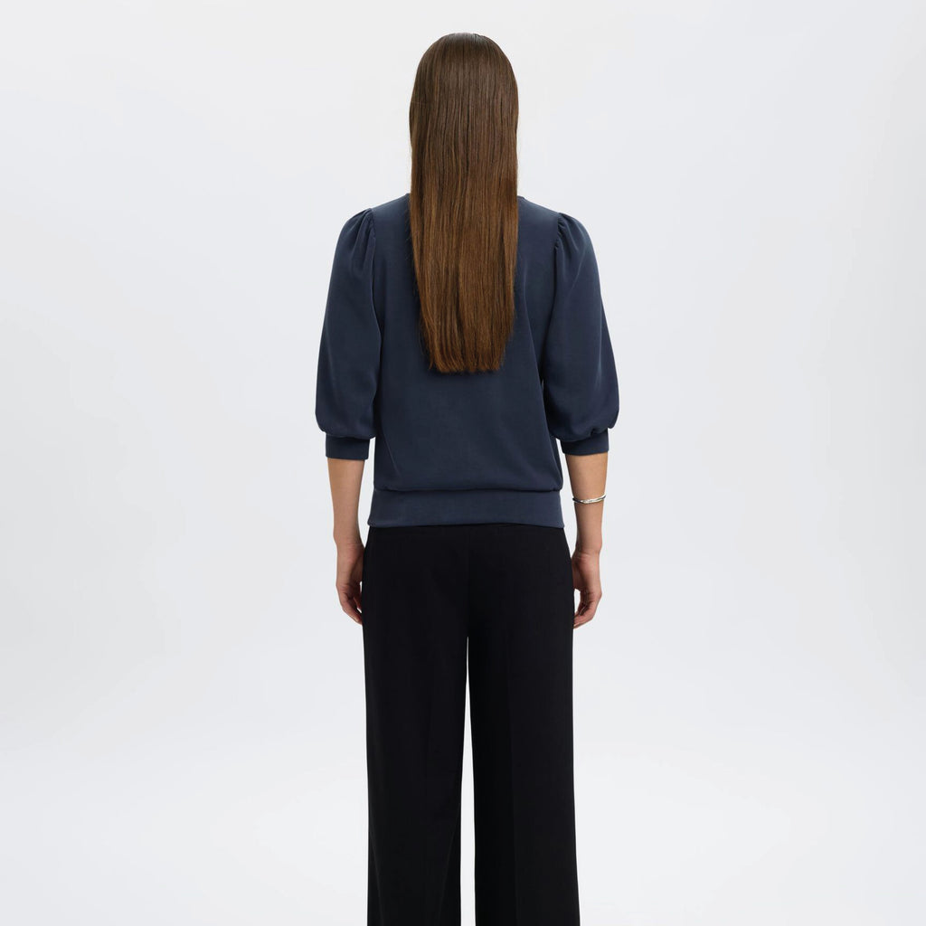 Navy blue sweater with puff sleeves.
Selected Femme Tenny Dark Sapphire Puff Sleeve Sweatshirt - Jo And Co Selected Femme Tenny Dark Sapphire Puff Sleeve Sweatshirt - Selected Femme