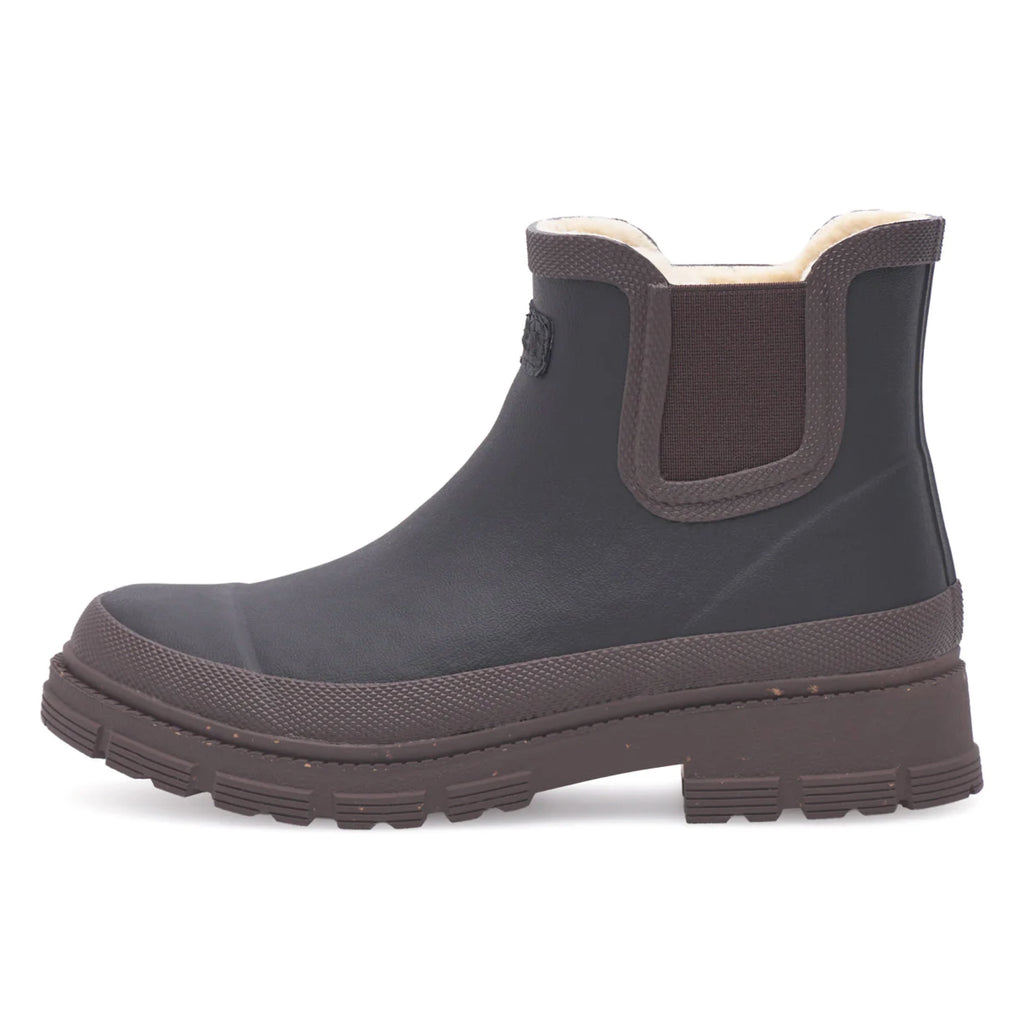 Black and brown rubber waterproof boots with a thick sole.
Woden Black & Chocolate Liv Waterproof Rubber Boots - Jo And Co Woden Black & Chocolate Liv Waterproof Rubber Boots - Woden